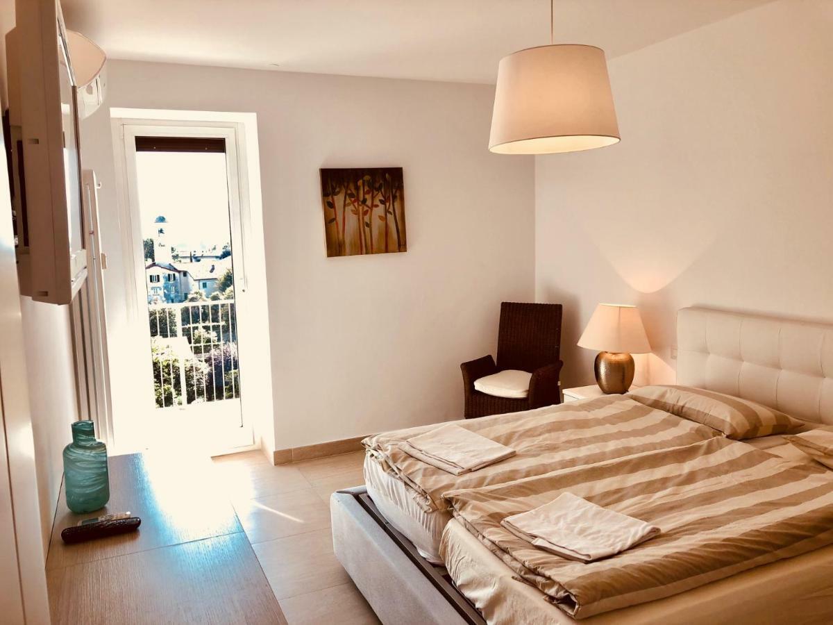 Attico Palazzo Di Vetro Apartment ลุยโน ภายนอก รูปภาพ